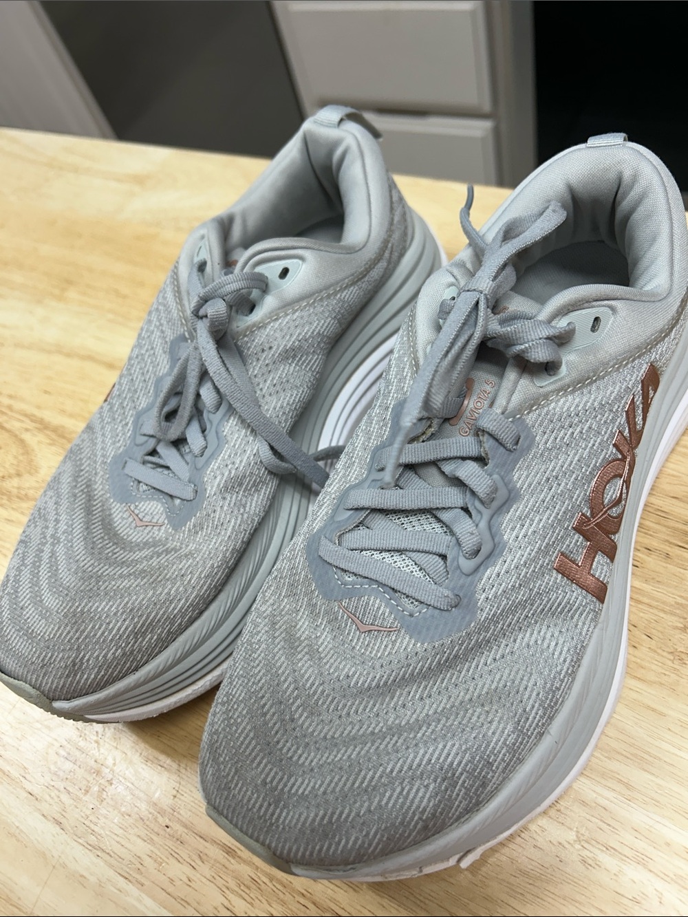 Hoka Light Gray Athletic Running Shoes with Rose Gold Logo
